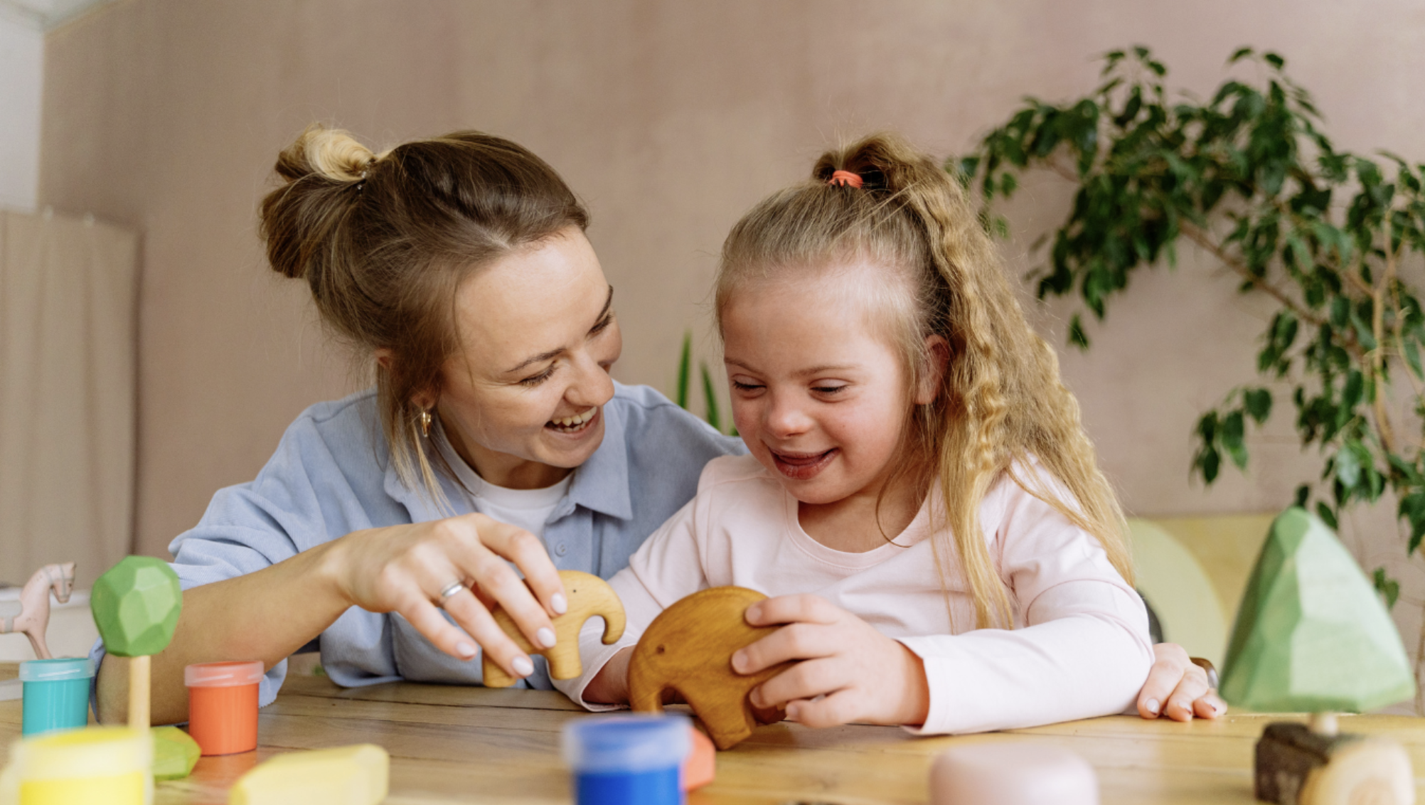 A foster carer spending time with a young child.