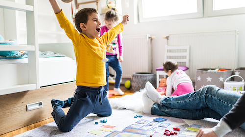 Boy playing games with parent