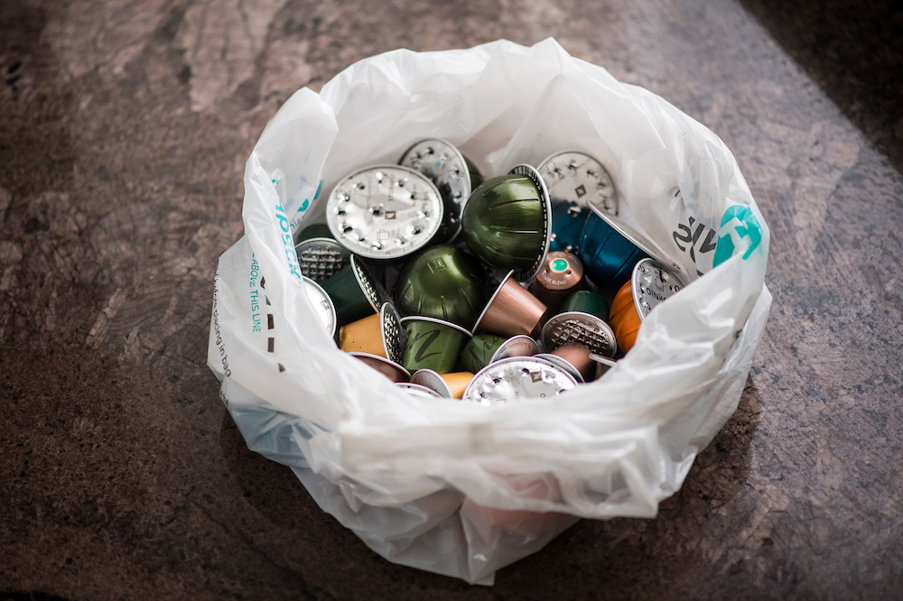 Coffee pods in a bin lined with a Podback liner.