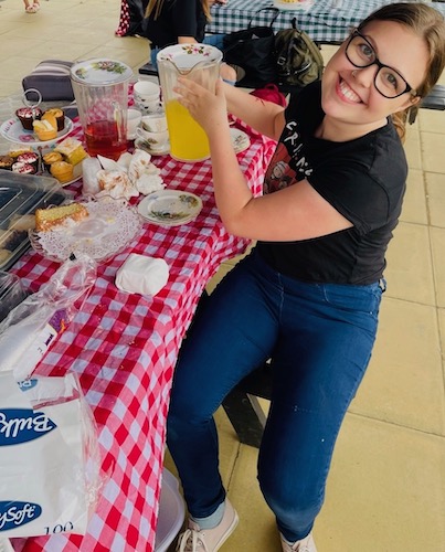 Girl holding a jug of fruit juice