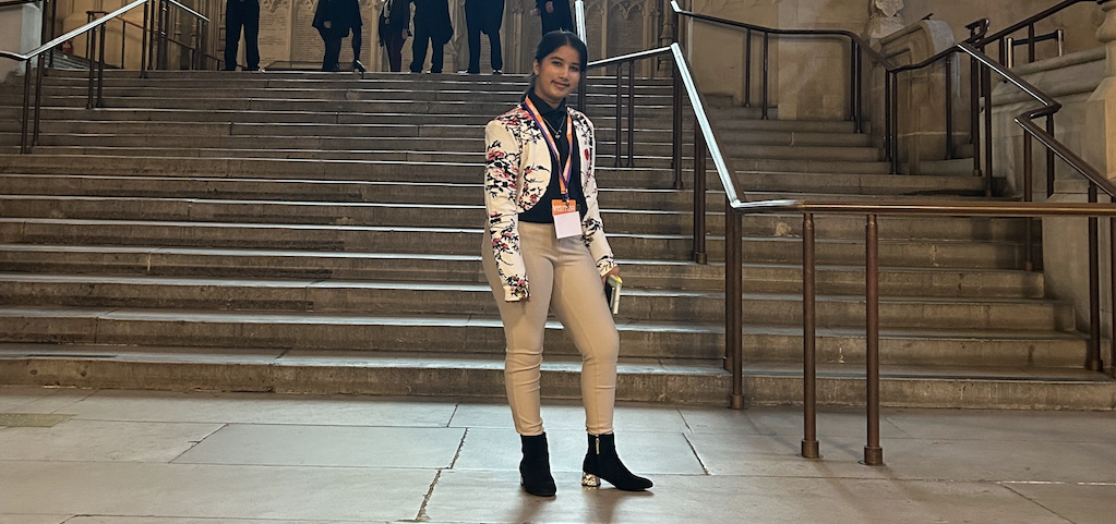 Surbhi, standing by some stairs in Parliament.