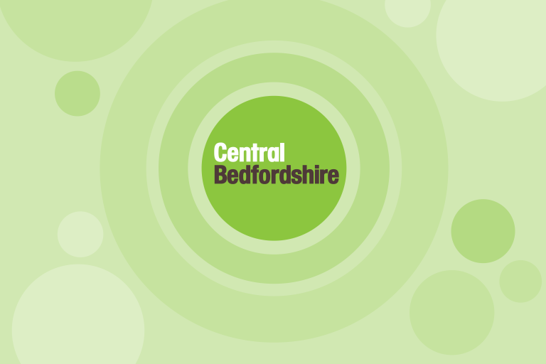 Central Bedfordshire Council logo in white and dark text inside a green circle, with pale green concentric rings background.